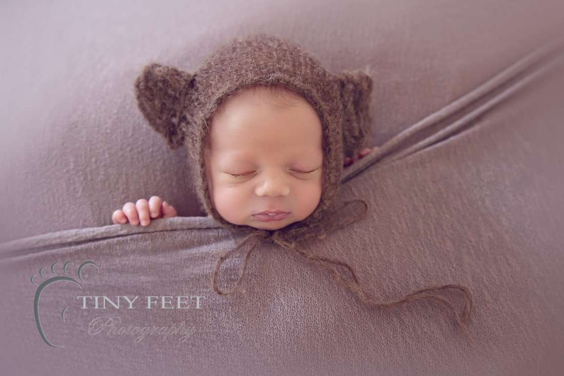 Tiny Feet Photography Newborn baby boy tucked in to brown blanket