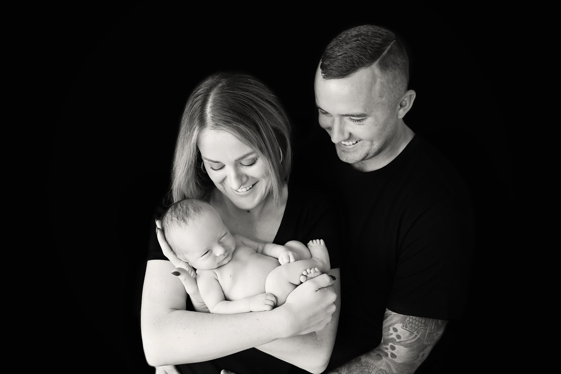 Tiny Feet Photography Black and white Baby boy posed  with mum and dad
