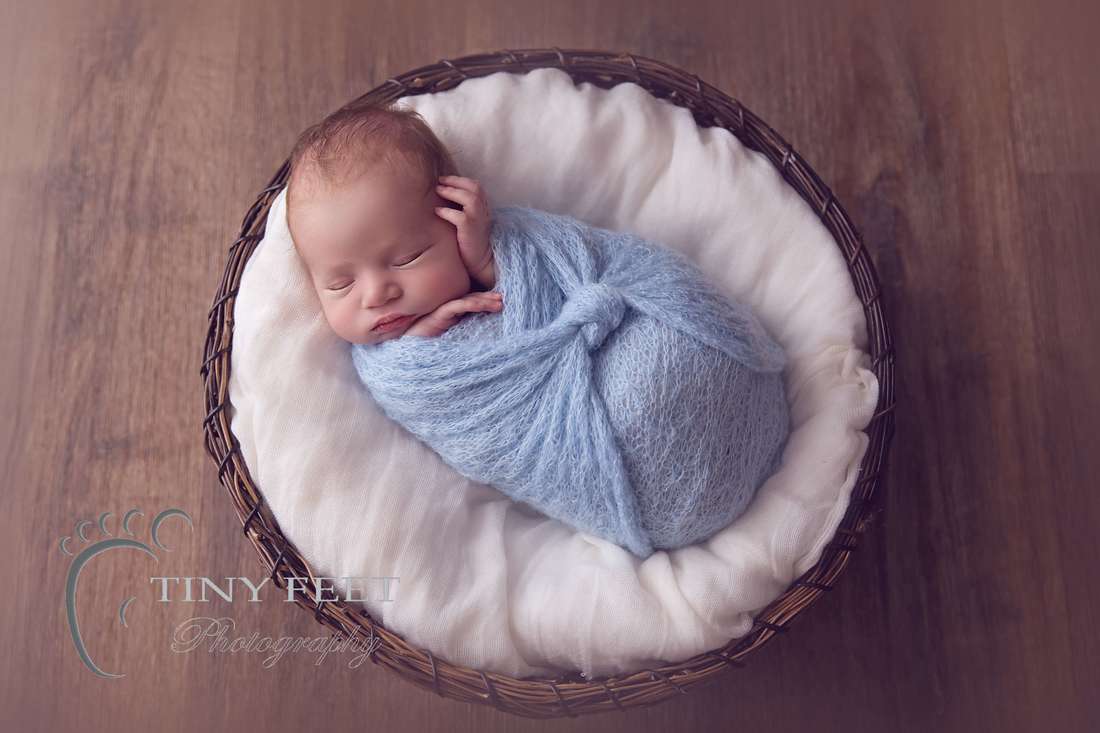 Tiny Feet Photography, newborn baby boy wrapped in blue in brown bowl