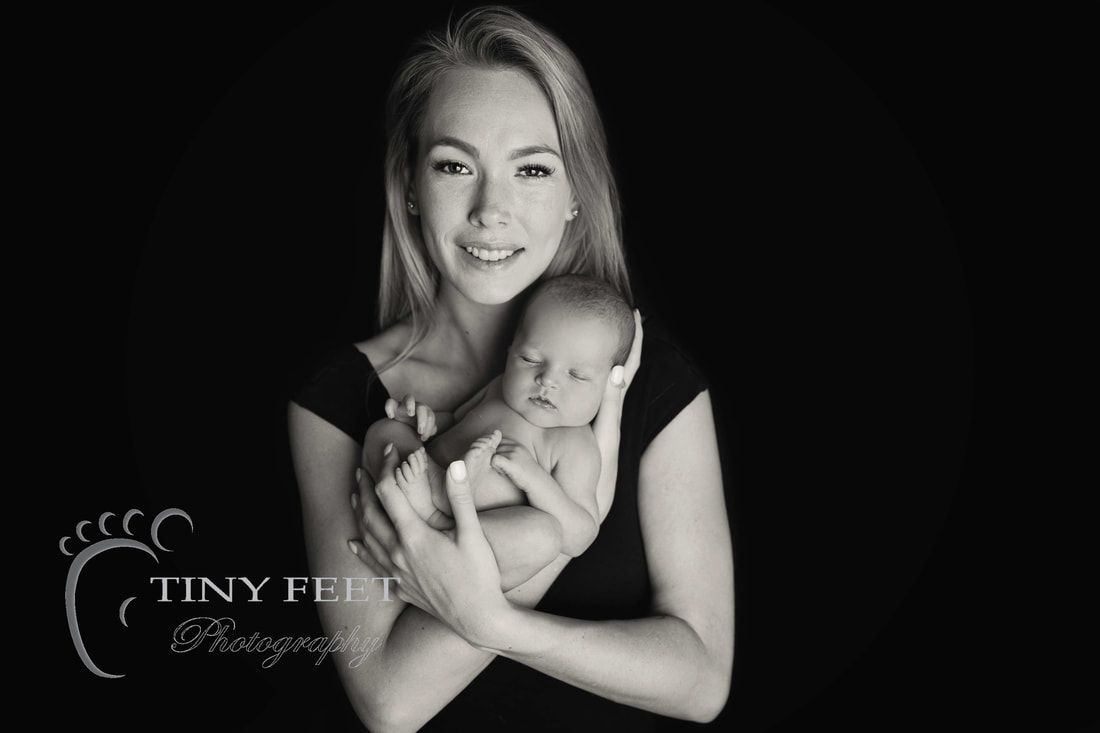 Tiny Feet Photography black and white image newborn baby posed with mum 