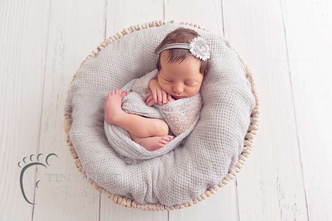Tiny Feet Photography, newborn baby girl in grey wrap in a bowl