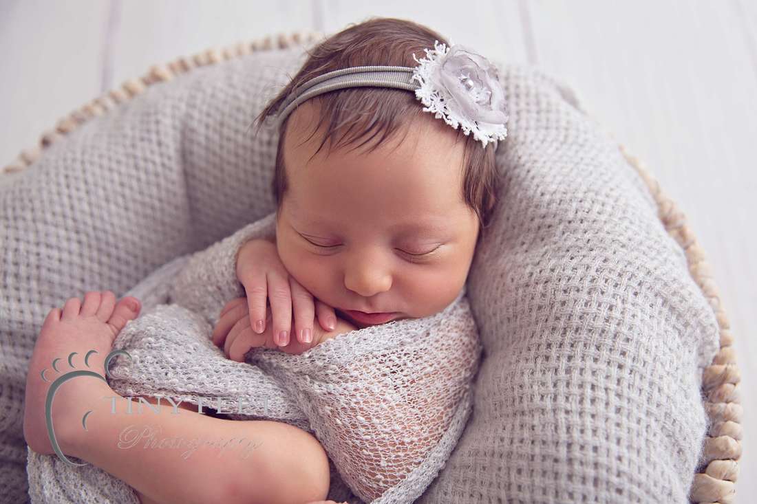 Tiny Feet Photography, newborn baby girl in grey wrap in a bowl