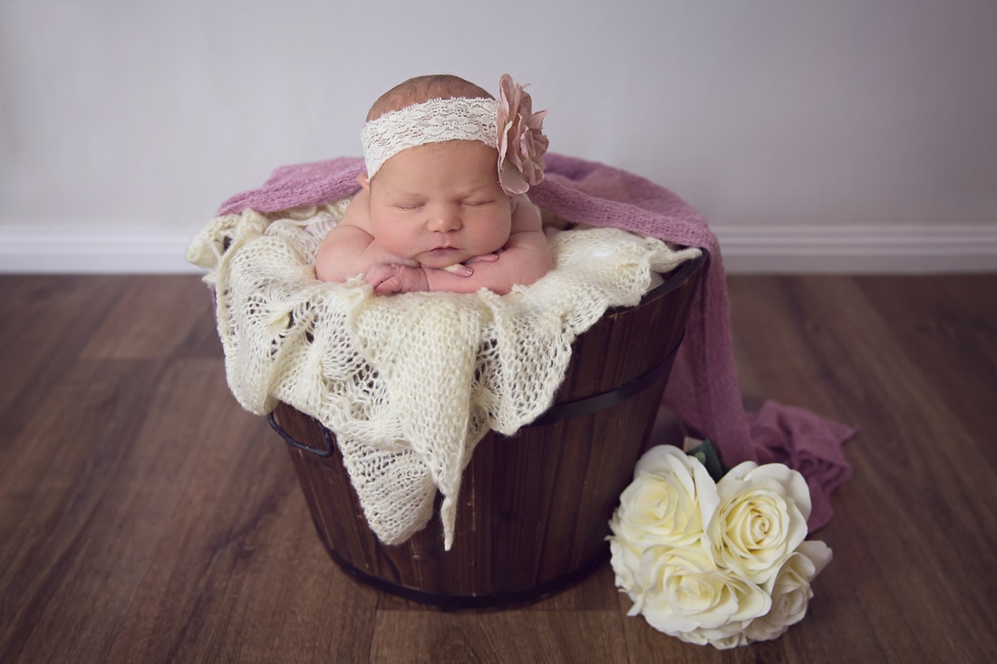 Tiny Feet Photography Newborn prop posing in bucket with flowers