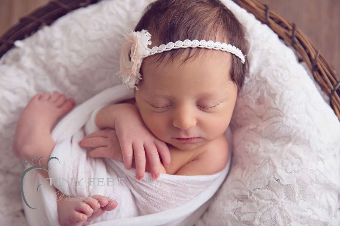 Tiny Feet Photography, newborn baby girl in white wrap in a bowl