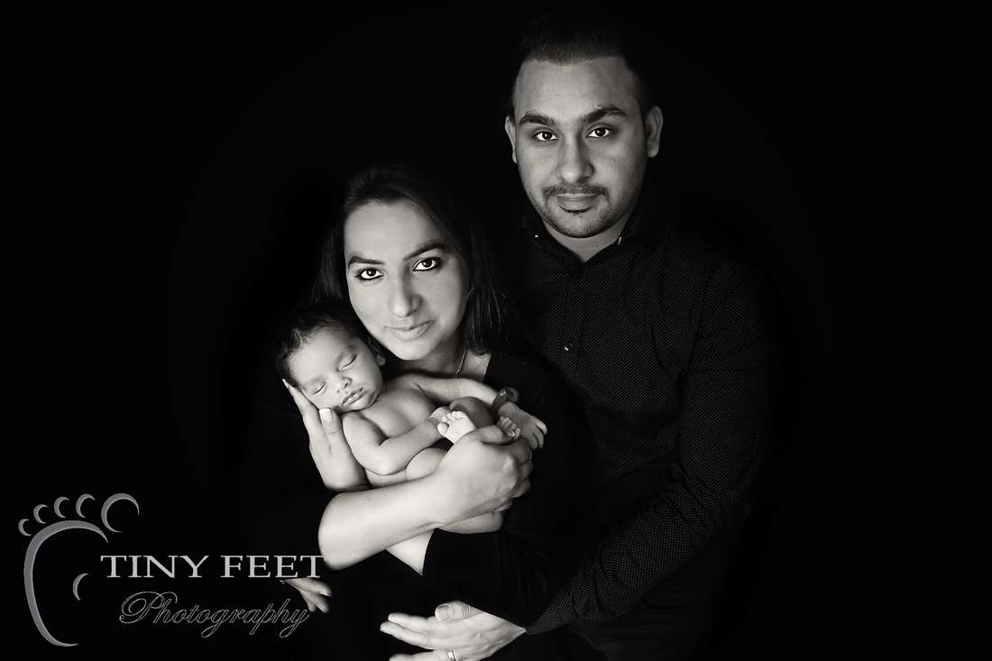 Tiny Feet Photography newborn baby posed with mum and dad in black and white