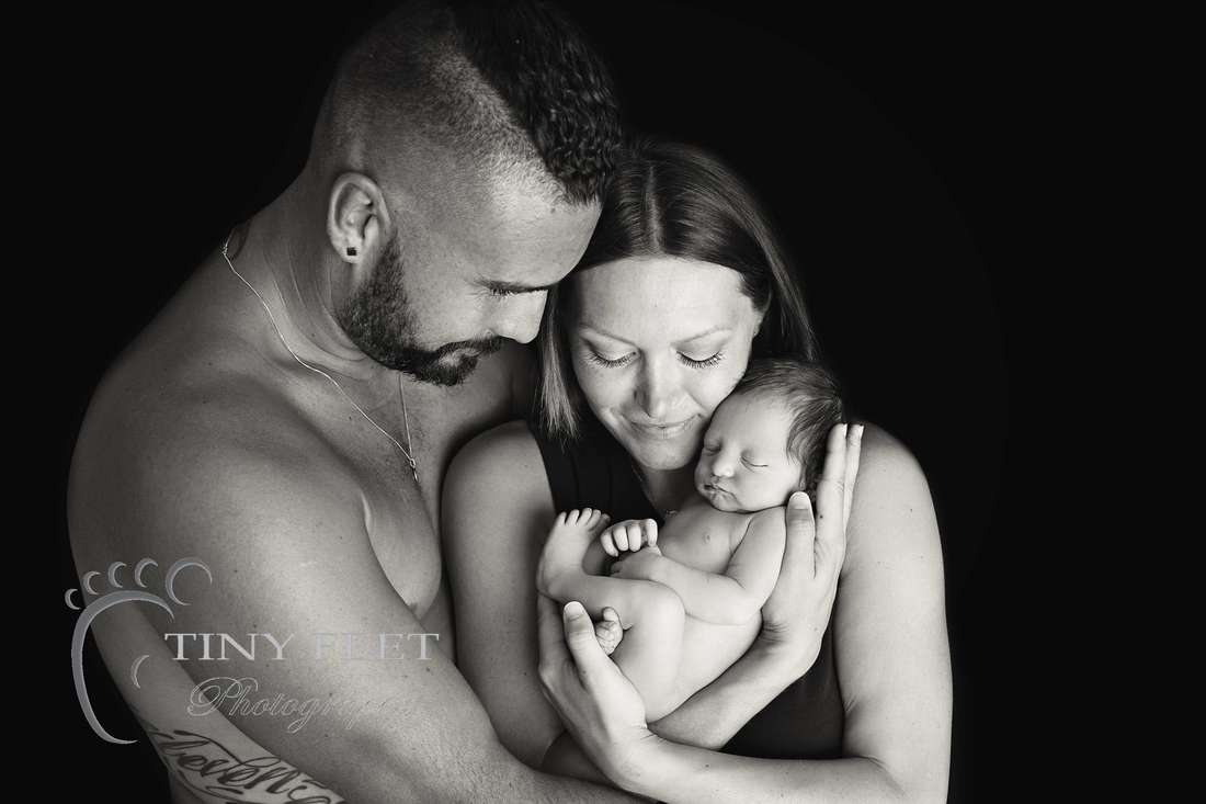Tiny Feet Photography, newborn baby in black and white posed with mum and dad