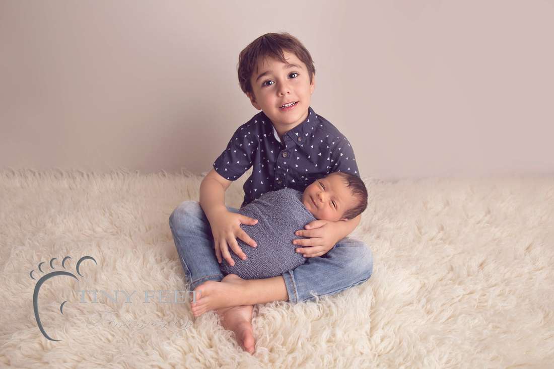 Tiny Feet Photography Newborn baby boy posed with 3 year old sibling