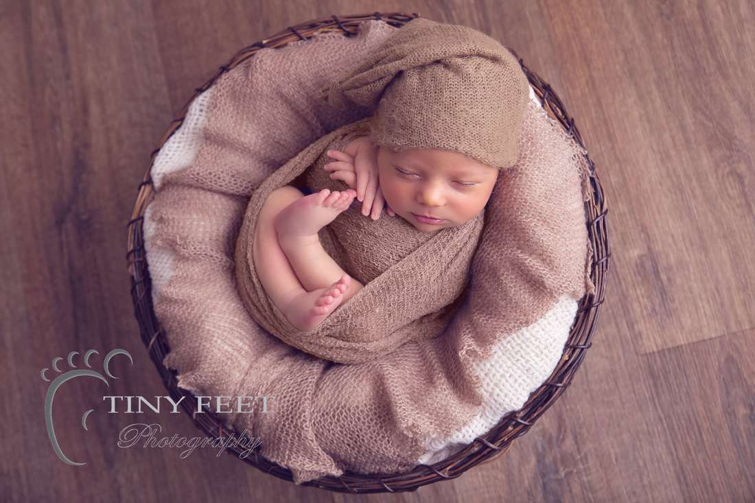 Tiny Feet Photography Newborn baby boy wrapped in brown in bowl