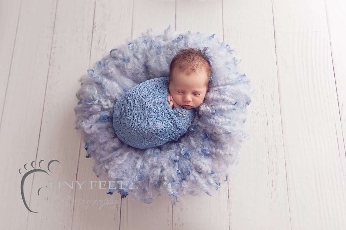 Tiny Feet Photography baby boy wrapped in blue wrap in bowl