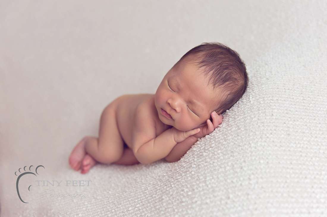 Tiny Feet Photography Newborn baby boy side pose on beanbag