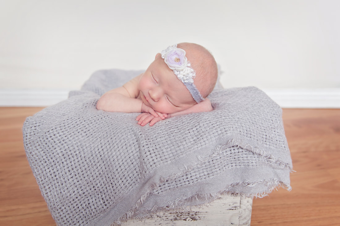 Tiny Feet Photography Newborn baby posing in basket