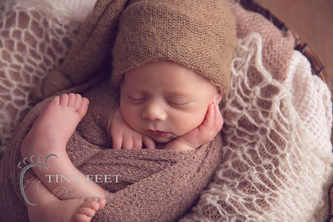 Tiny Feet Photography newborn boy posed in brown bowl