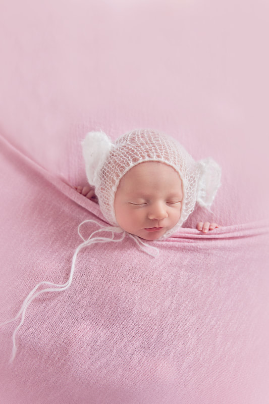 Tiny Feet Photography Newborn baby tucked in pose