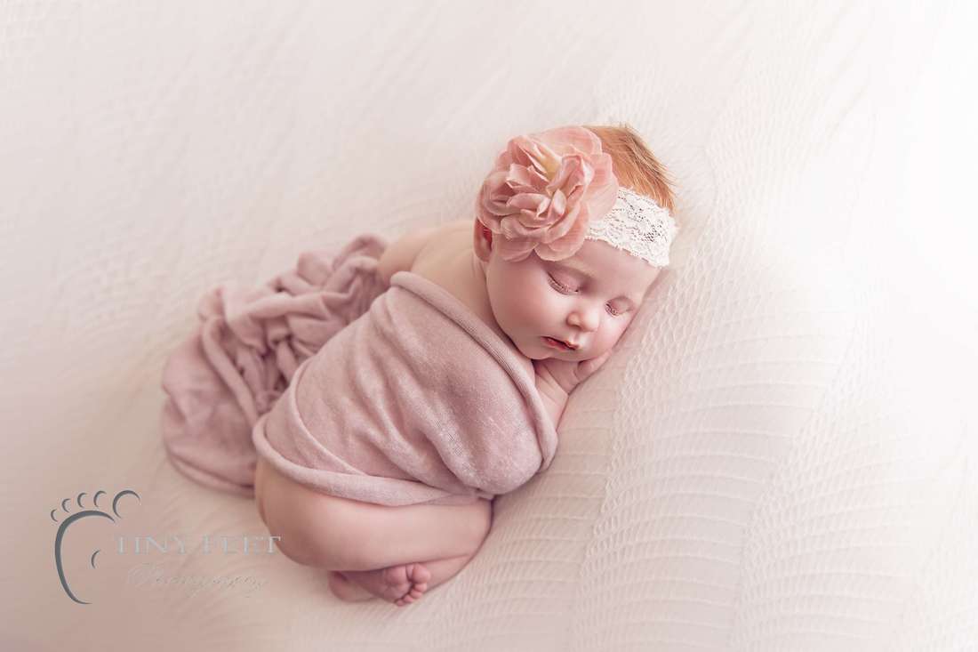 Tiny Feet Photography baby girl on white blanket