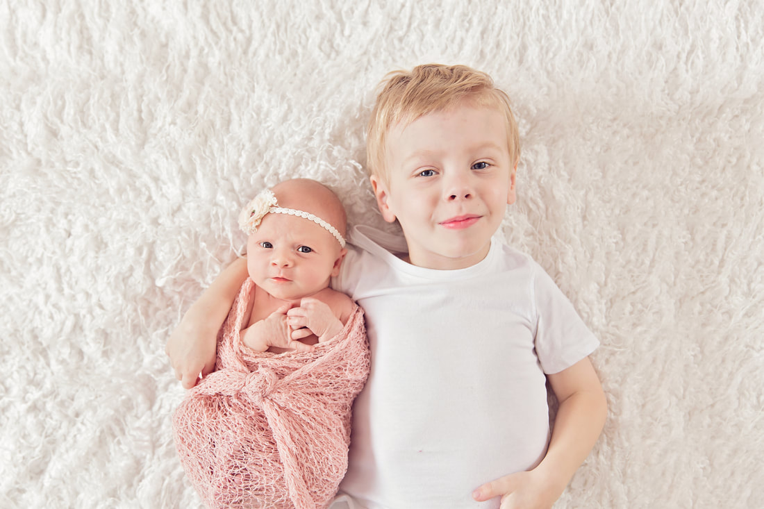 Tiny Feet Photography Newborn baby posing with  sibling