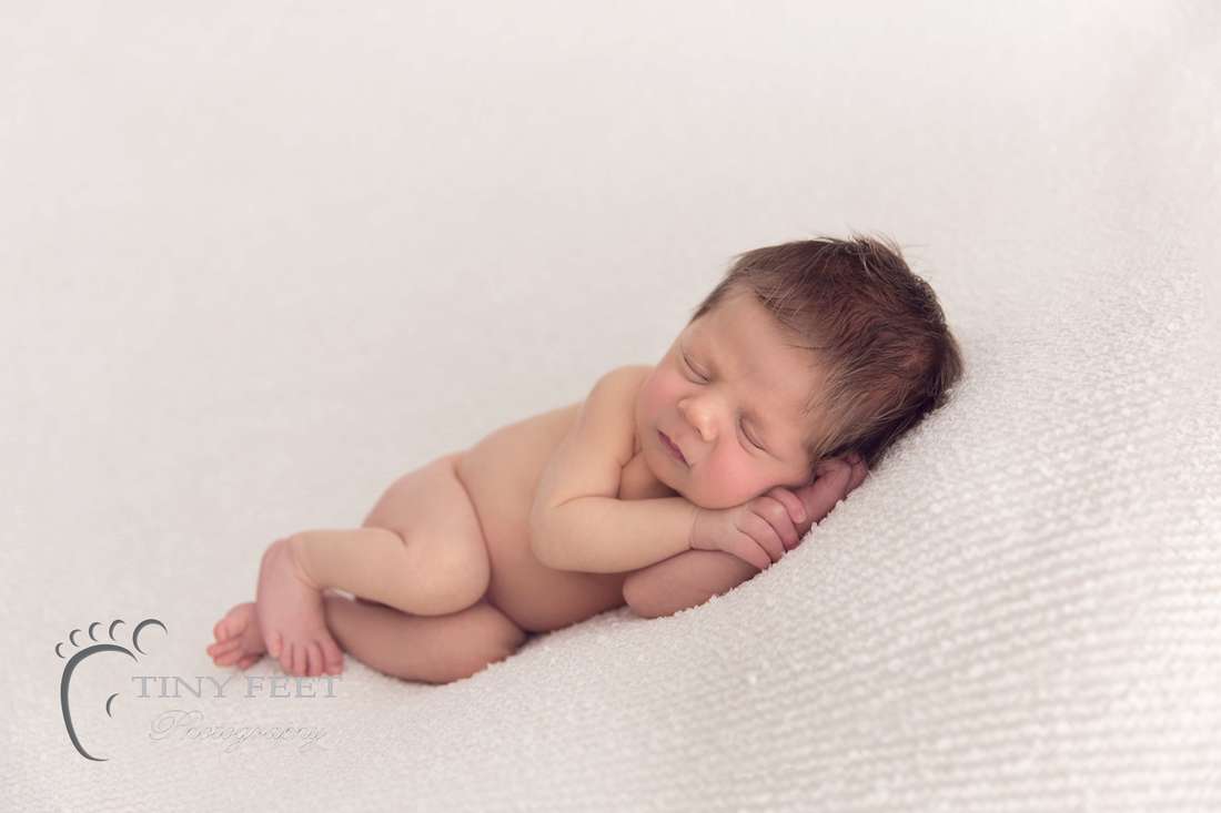 Side laying newborn pose