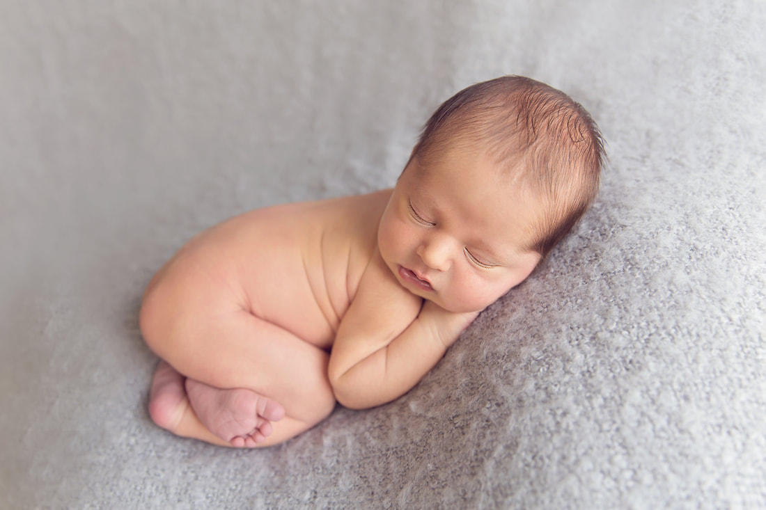 Tiny Feet Photography Newborn baby boy on grey blanket