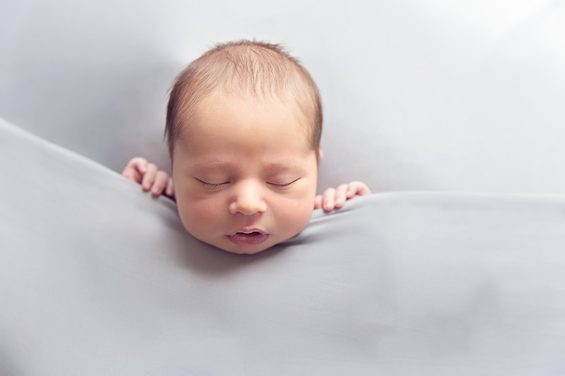 Tiny Feet Photography Newborn baby boy on grey blanket
