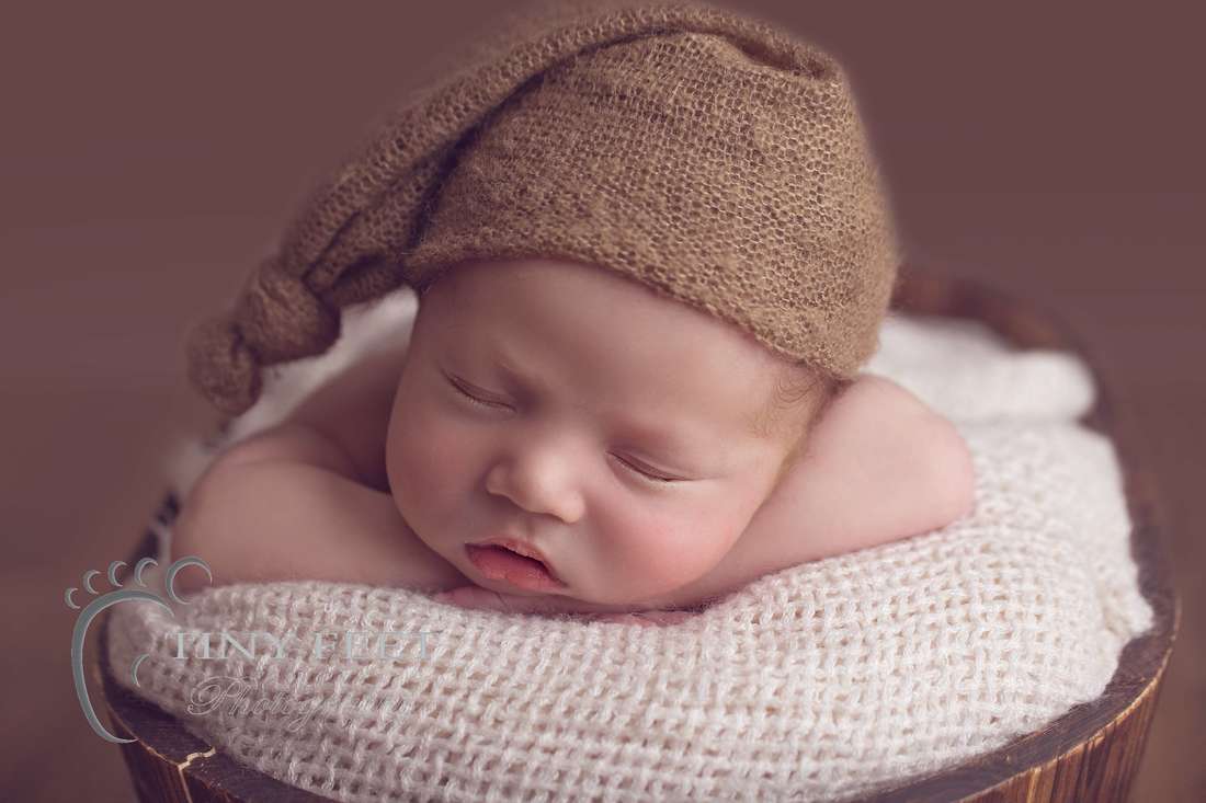 Tiny Feet Photography, newborn baby boy close up of posed chin in hands in bucket