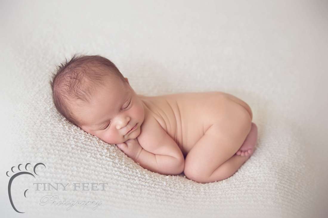 Tiny Feet Photography Newborn boy on cream blanket in bum um pose