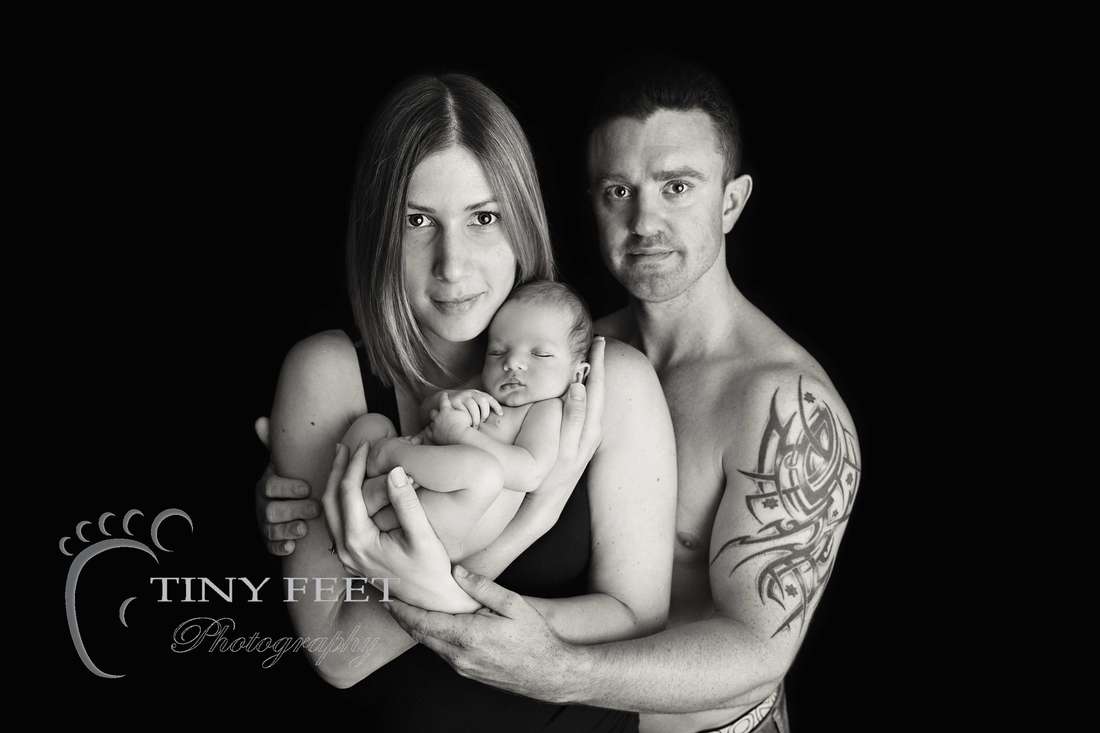 Tiny Feet Photography, newborn baby boy posed with mum and dad in black and white
