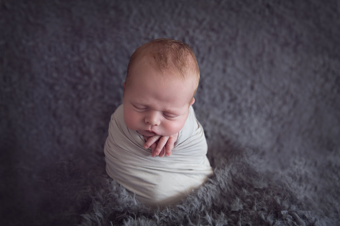 Tiny Feet Photography Potato sack pose newborn baby on grey flokati