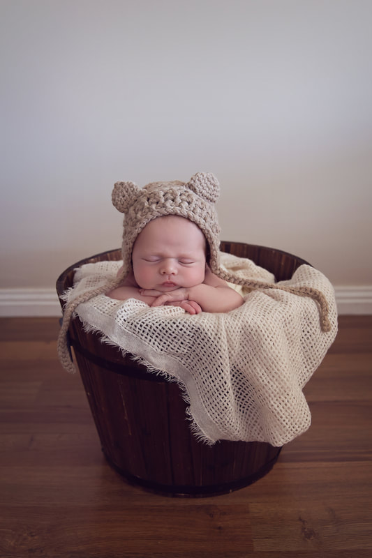Tiny Feet Photography Baby in brown bucket Newborn posing