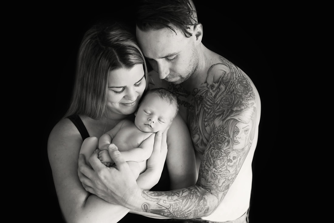 Tiny Feet Photography Black and white family posing newborn baby