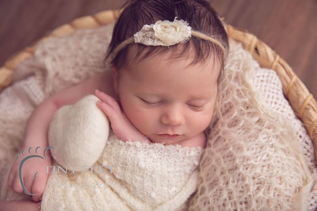 Tiny Feet Photography newborn baby girl in cream wrap in cream basket