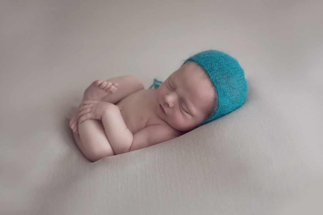 Tiny Feet Photography Newborn baby Huck finn pose on blanket