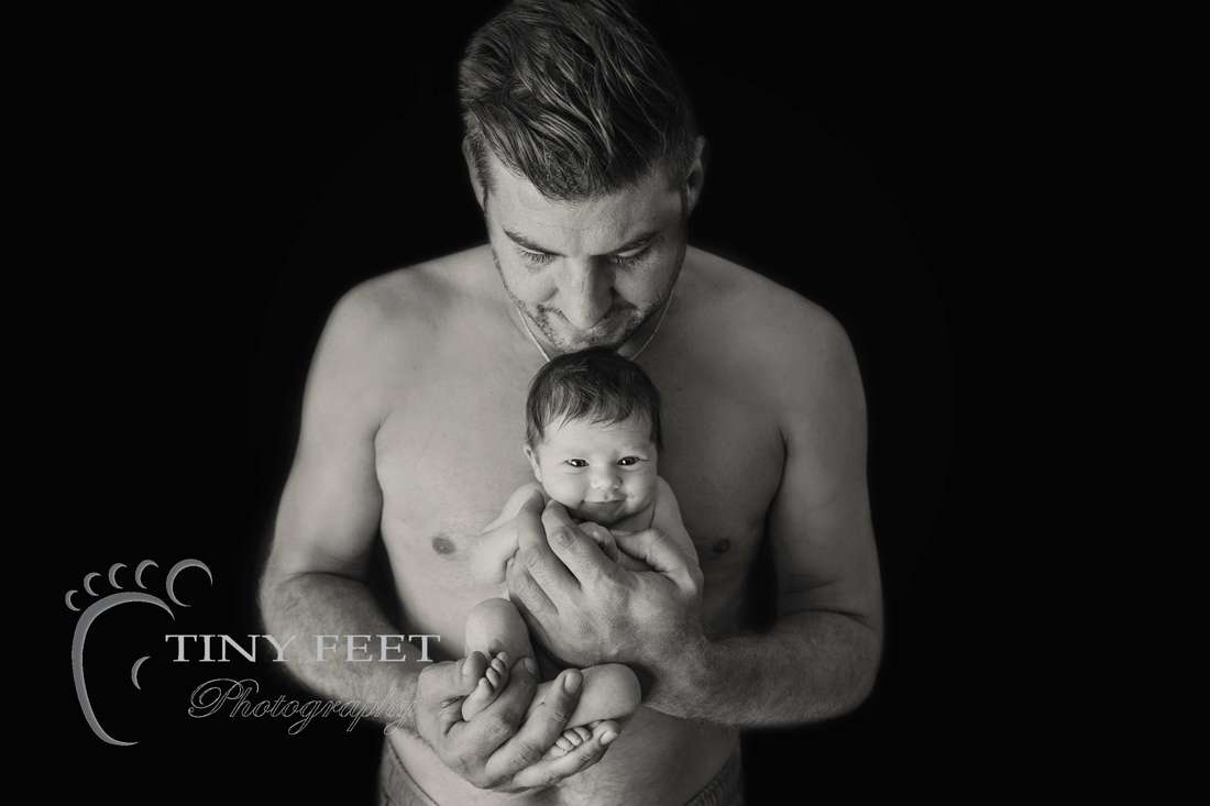 Tiny Feet Photography black and white newborn image with dad