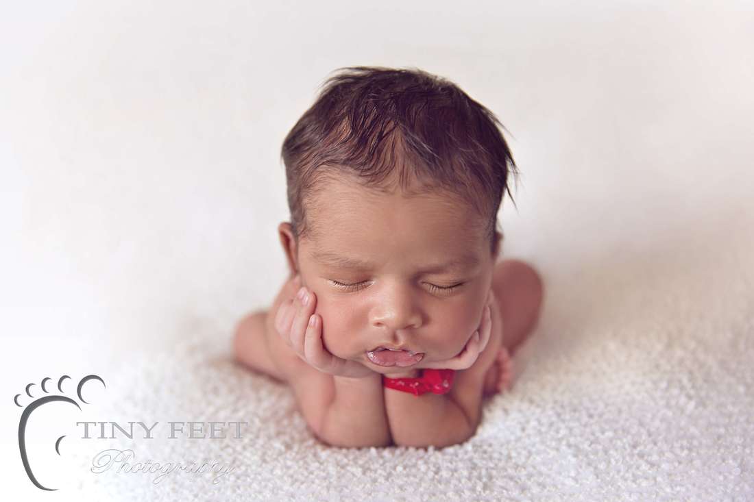 Tiny Feet Photography newborn baby boy posed in froggy pose on beanbag