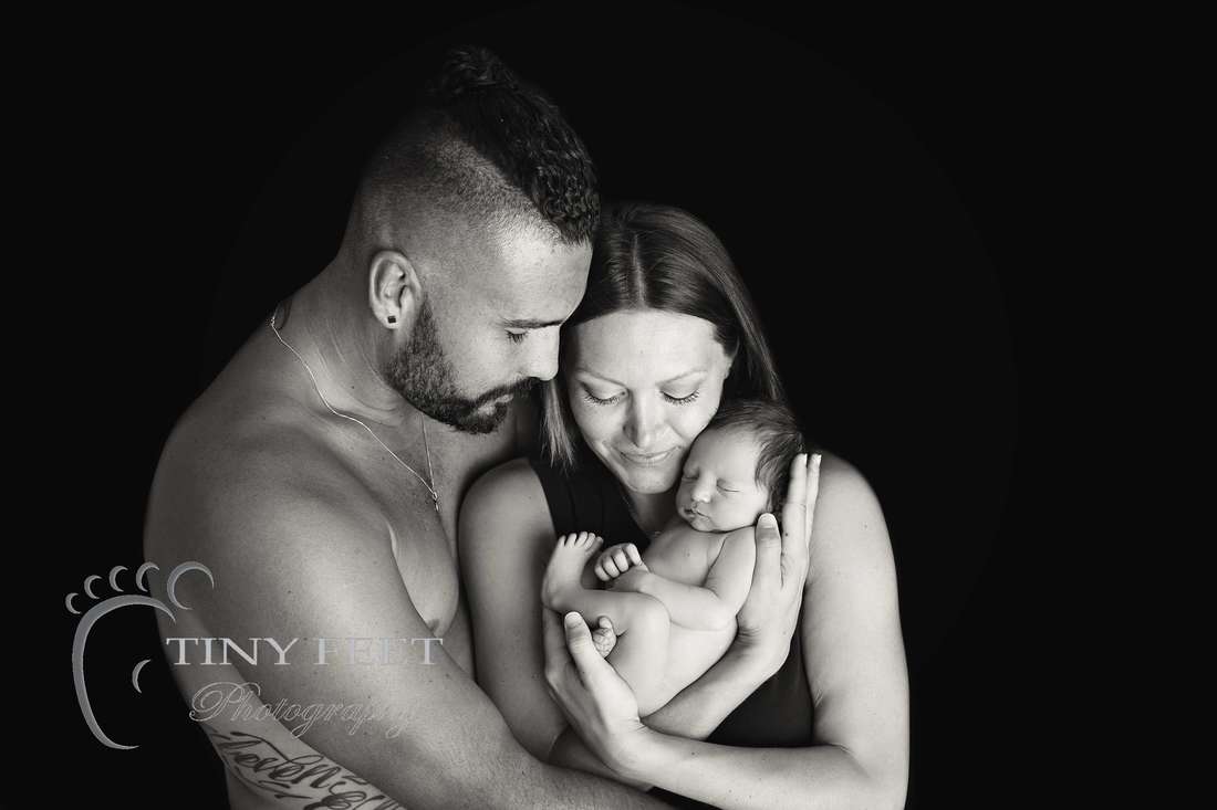 Tiny Feet Photography, newborn baby in black and white posed with mum and dad