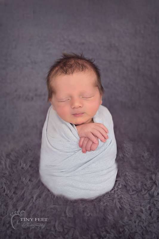 Tiny Feet Photography Newborn baby in potato sack pose