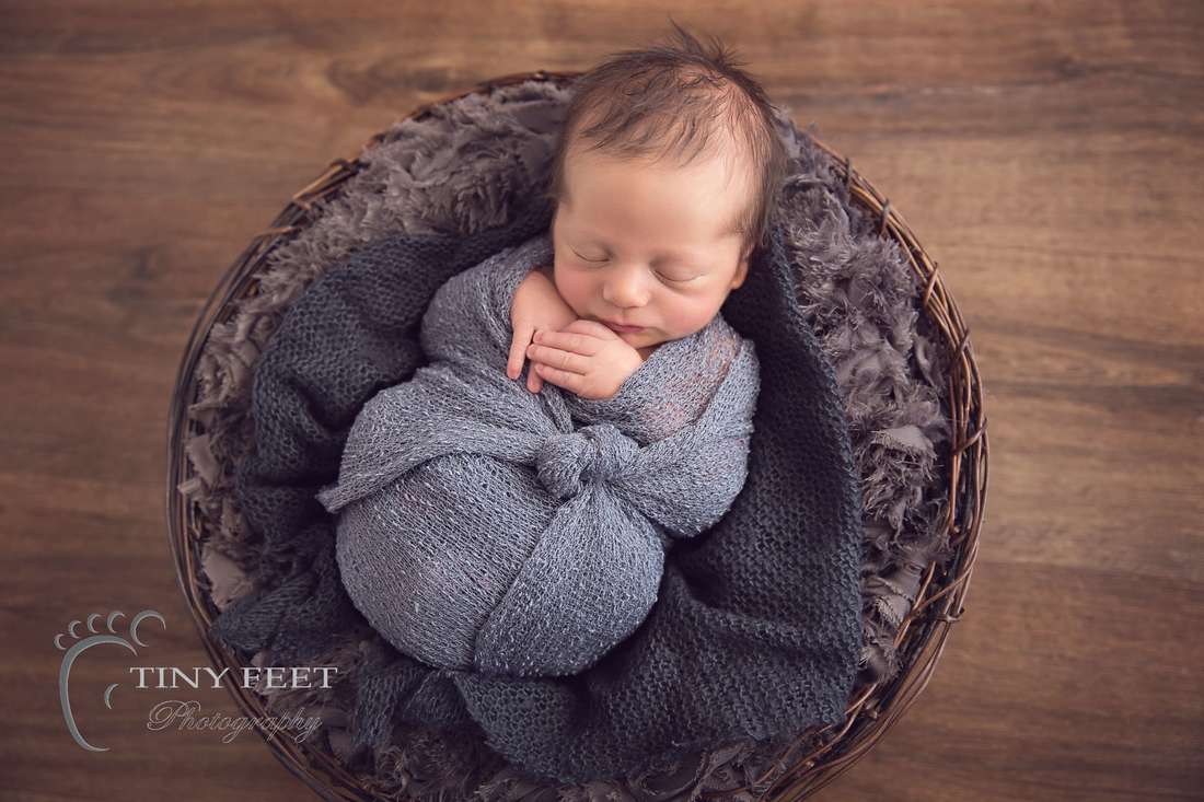 Tiny Feet Photography Newborn baby in grey blanket in basket