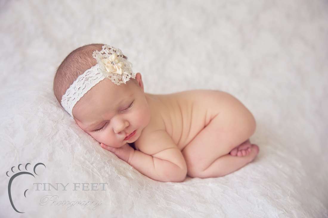 Tiny Feet Photography Newborn in bum up pose on lace blanket