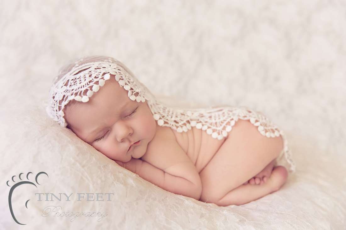 Tiny Feet Photography Newborn posed in bum up pose on lace blanket