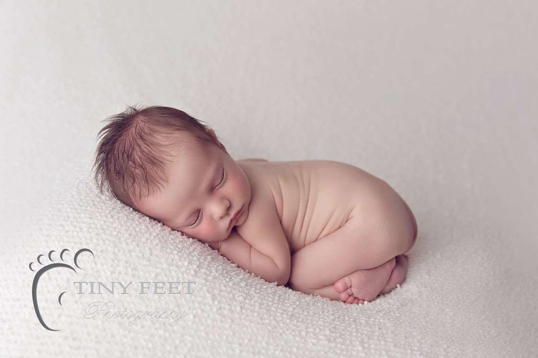 Tiny Feet Photography baby boy posed in bum up on cream blanket