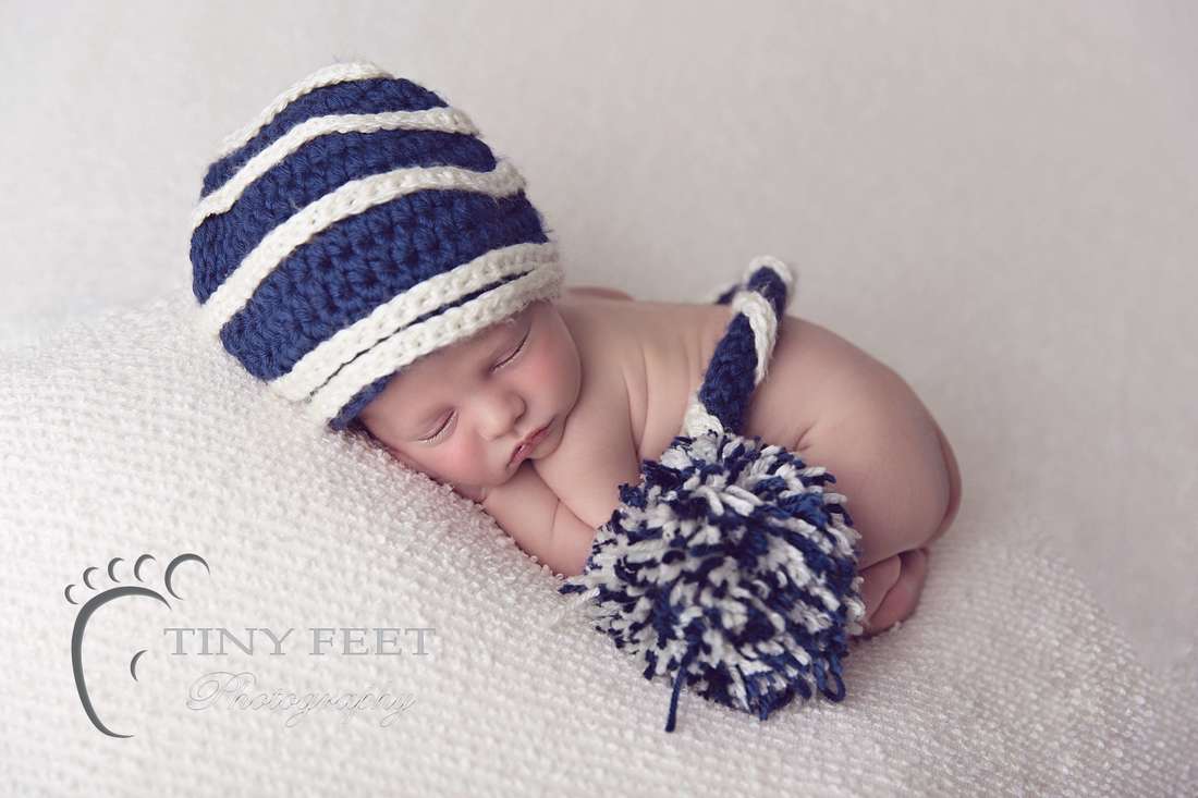 Tiny Feet Photography baby boy posed in bum up on cream blanket