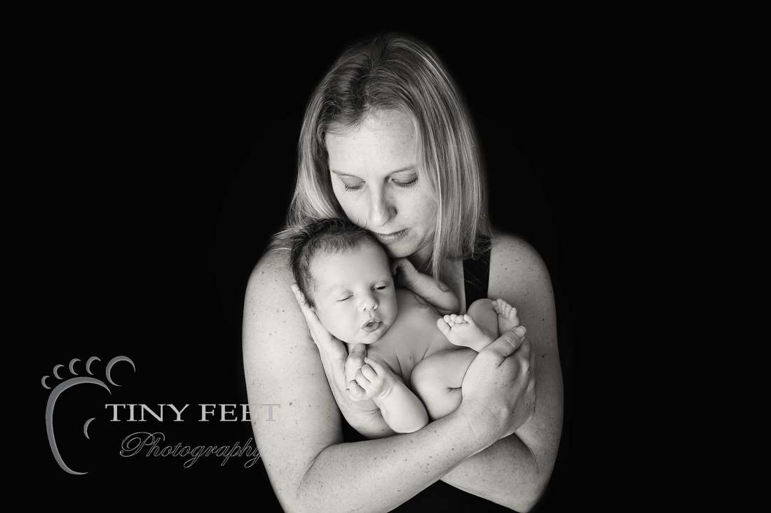 Tiny Feet Photography baby boy posed in mums hands