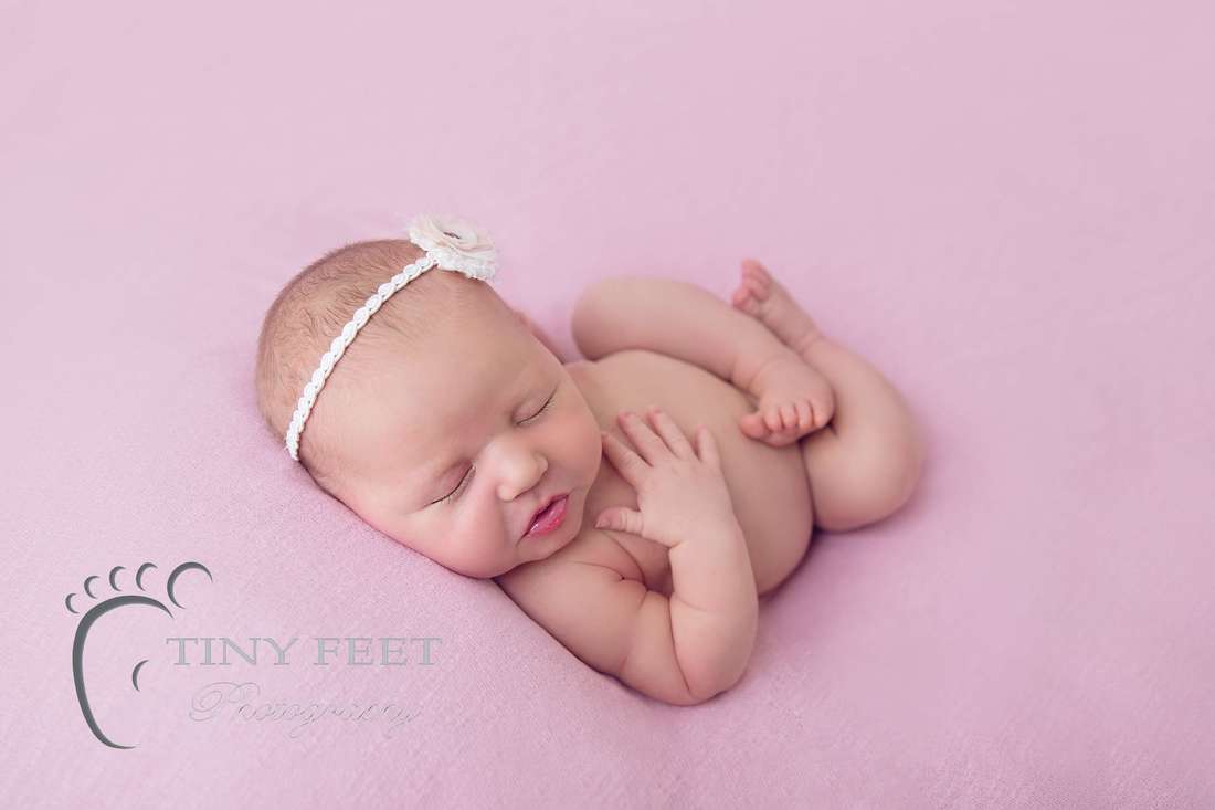 Tiny Feet Photography newborn baby girl posed on pink blanket in huck finn