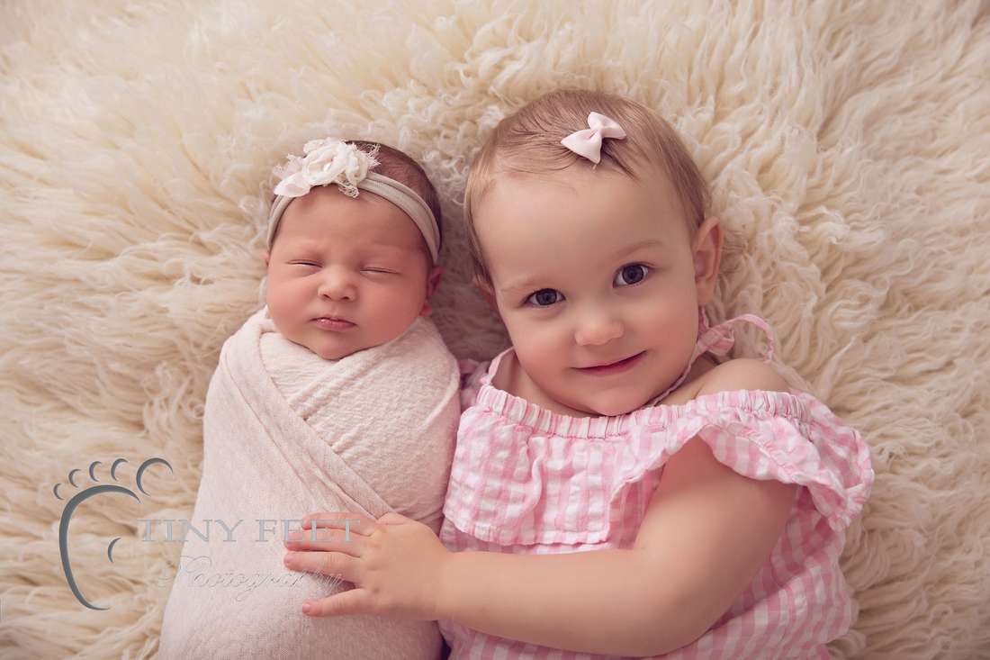 Tiny Feet Photography baby girl posed with 2 year old sibling