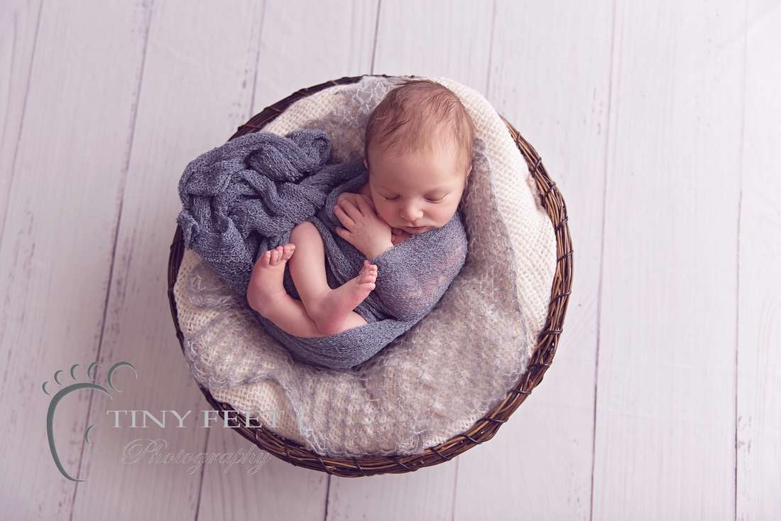 Tiny Feet Photography baby boy wrapped in grey wrap in cream and brown basket