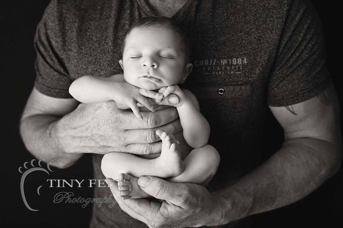 Tiny Feet Photography black and white shot of baby posed with dad