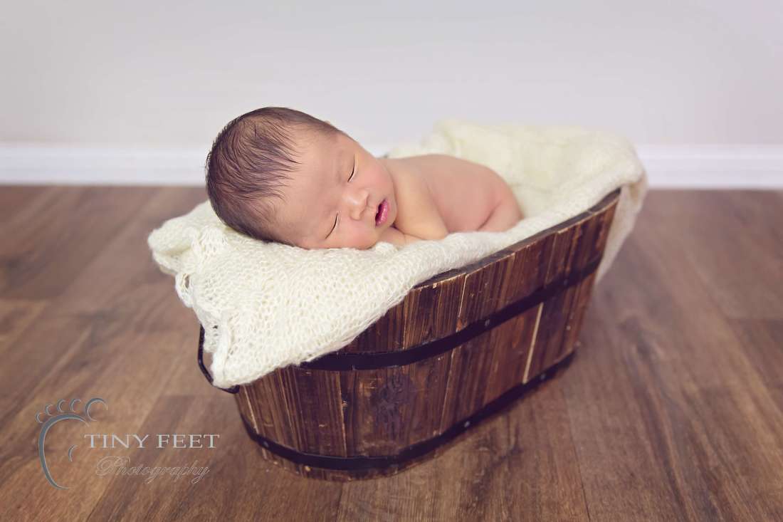 Tiny Feet Photography Newborn baby boy posed in bucket