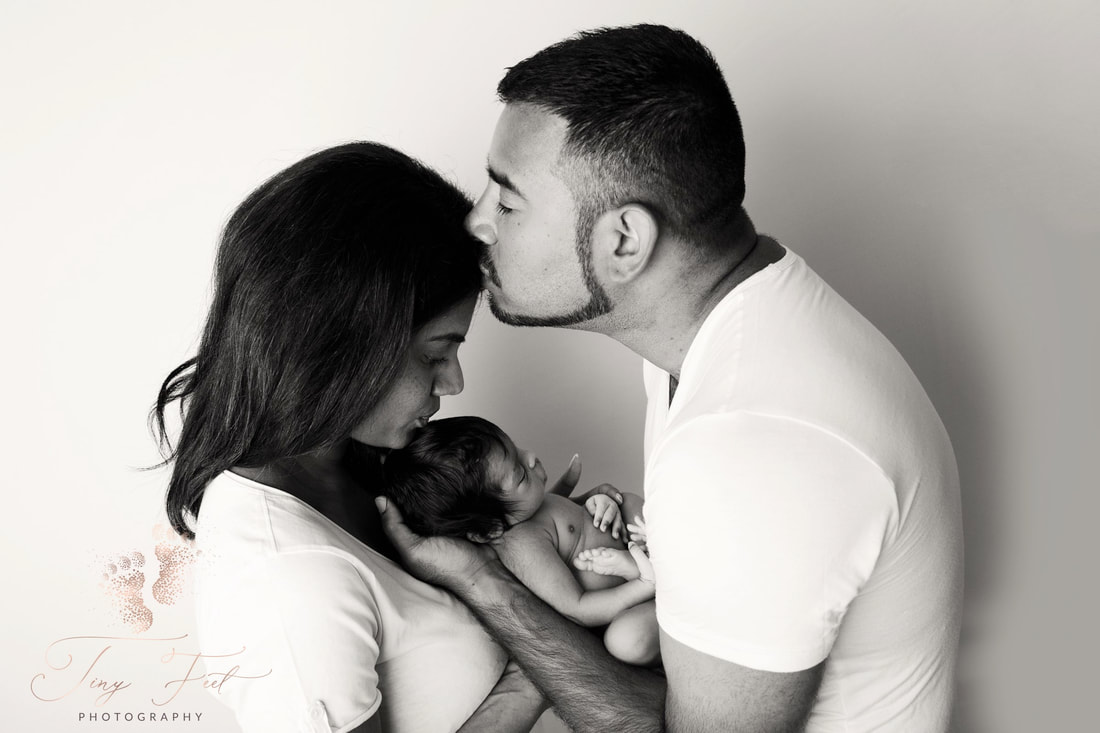 Tiny Feet Photography Newborn girl posed with parents