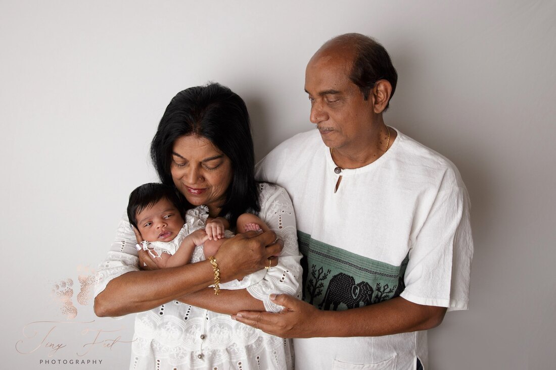 Tiny Feet Photography Newborn girl posed with grand parents