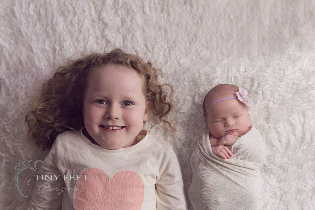 Newborn photography sibling posing
