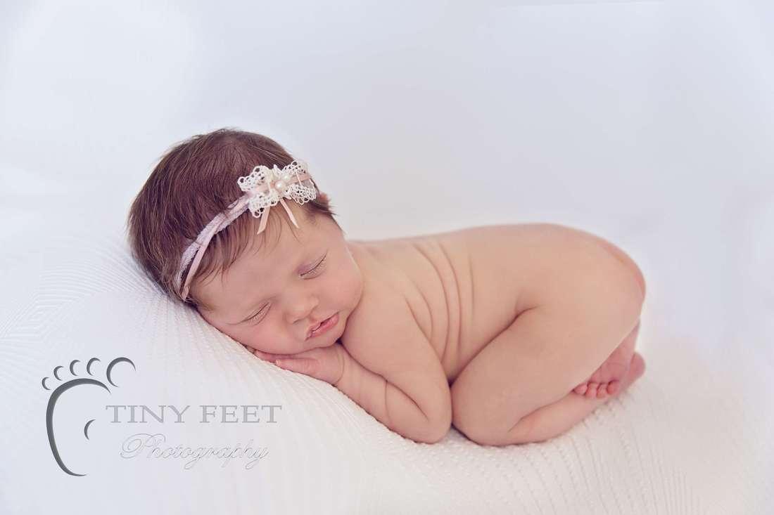 Tiny Feet Photography newborn baby girl posed in bum up pose on beanbag
