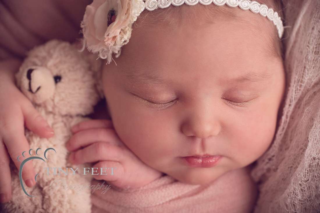 Tiny Feet Photography Perth newborn girl posed close up shot of face and features.